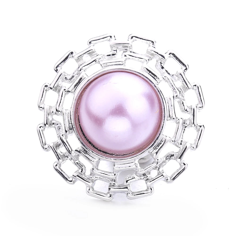 Silver metal snap buttons with a round pinkish pearl center for jewelry making