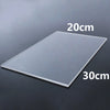 A clear acrylic sheet measuring 20cm by 30cm is shown on a dark surface.