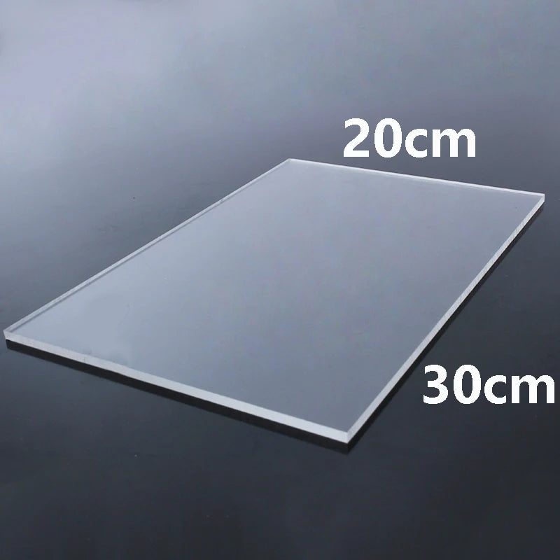 A clear acrylic sheet measuring 20cm by 30cm is shown on a dark surface.