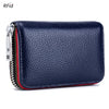 A dark blue genuine leather card holder with a zipper and RFID protection feature.