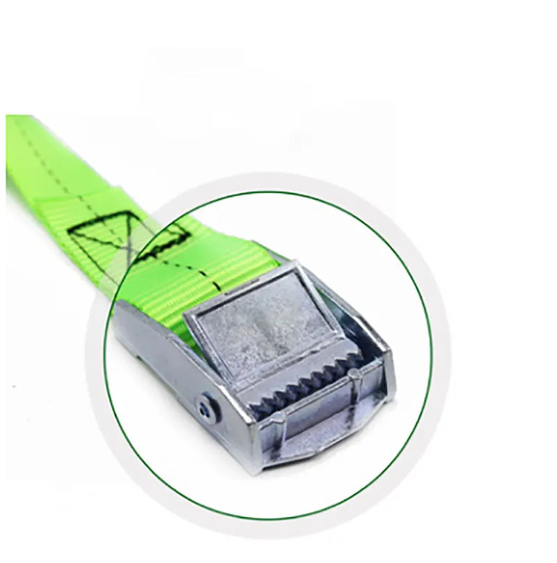 Close-up view of a lime green heavy-duty tie-down strap with a silver metal buckle.