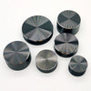 A collection of black aluminum knurled knobs used for 6mm shaft potentiometers and encoders.