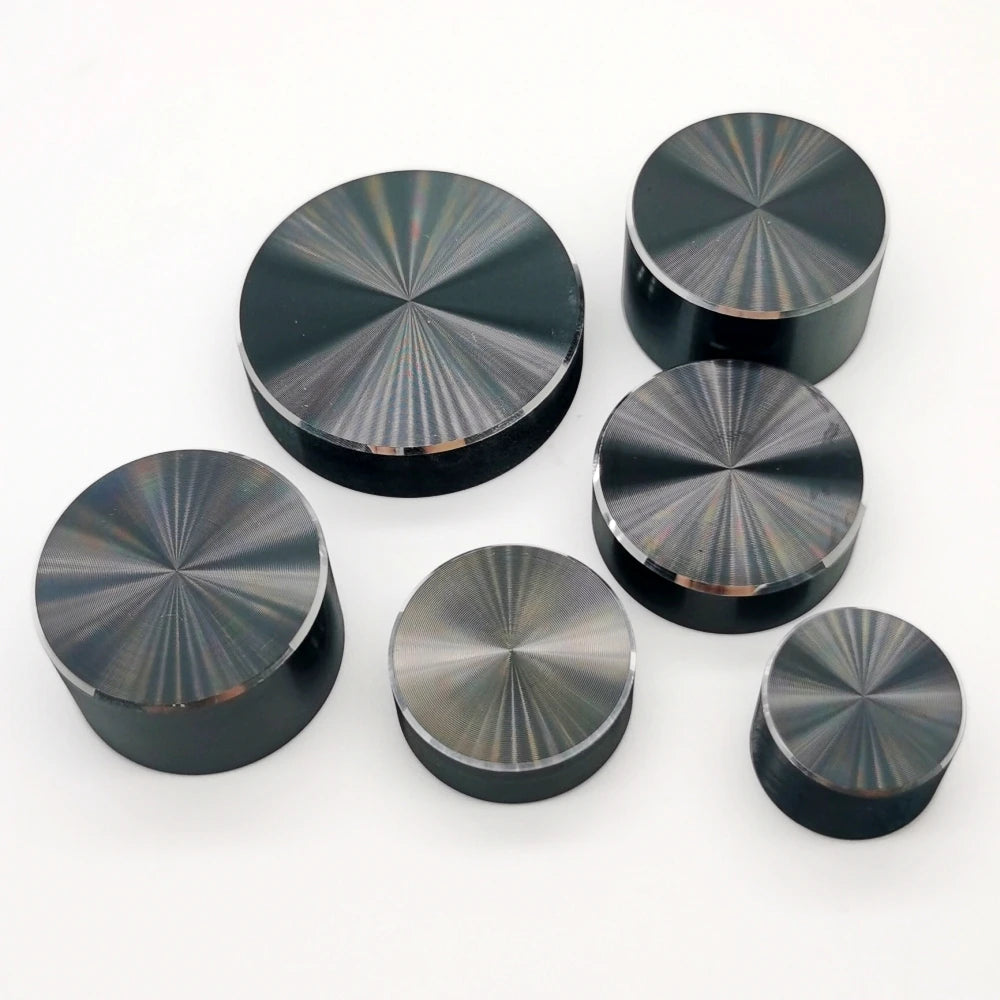 A collection of black aluminum knurled knobs used for 6mm shaft potentiometers and encoders.