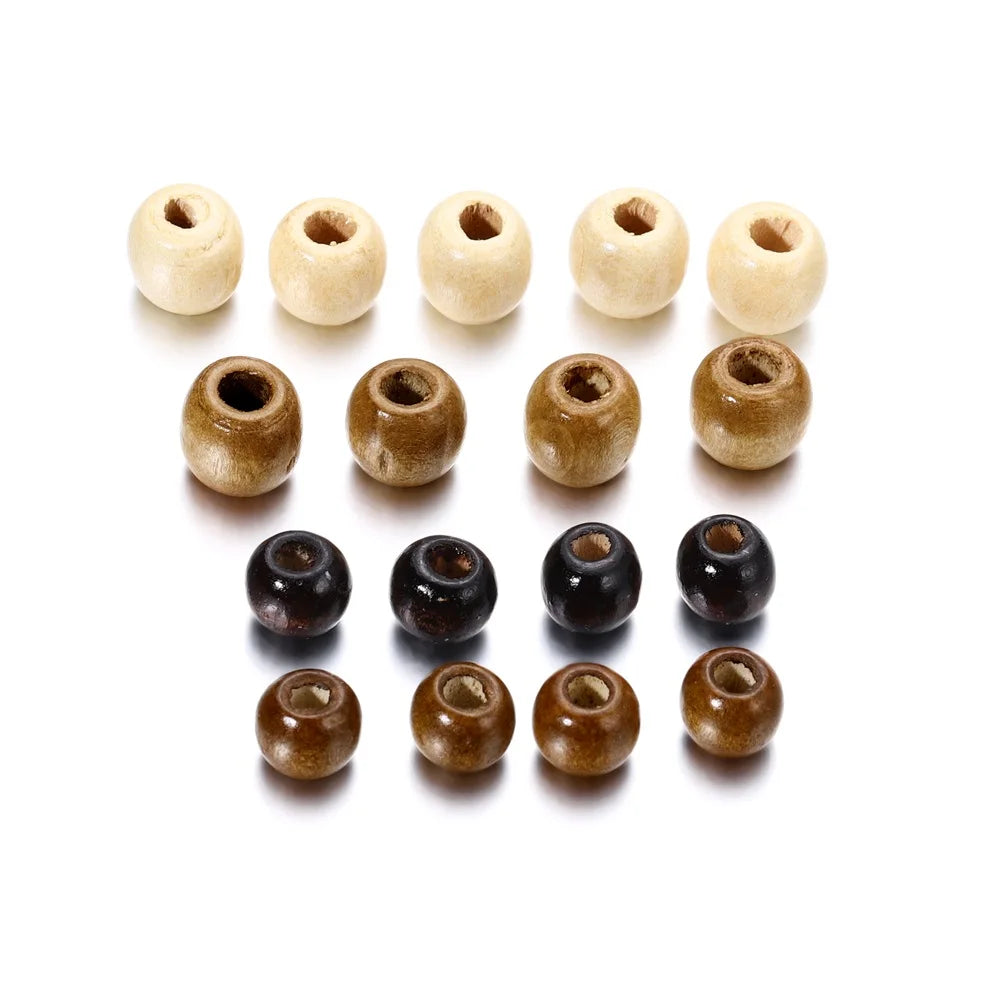 A collection of natural wooden spacer beads in various light and dark shades arranged in a row.