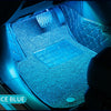 Ice blue ambient lighting illuminates the interior of a car with diamond-stitched upholstery and illuminated floor mats.