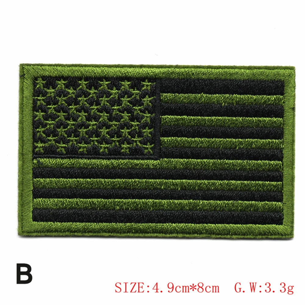 Embroidered American flag patch featuring the stars and stripes design in olive green and black thread.