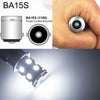 A close-up view of a BA15S single contact bayonet light bulb and an illuminated LED bulb.