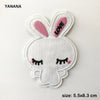 White embroidered bunny patch with pink inner ears and a black heart-shaped eye detail