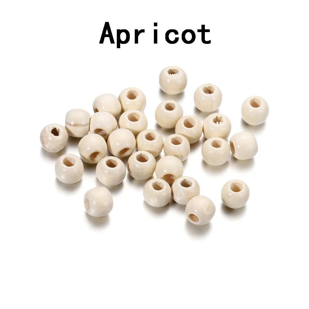 A collection of natural wooden spacer beads in various sizes and shades.
