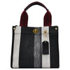 Black and white striped canvas crossbody tote bag with a maroon strap