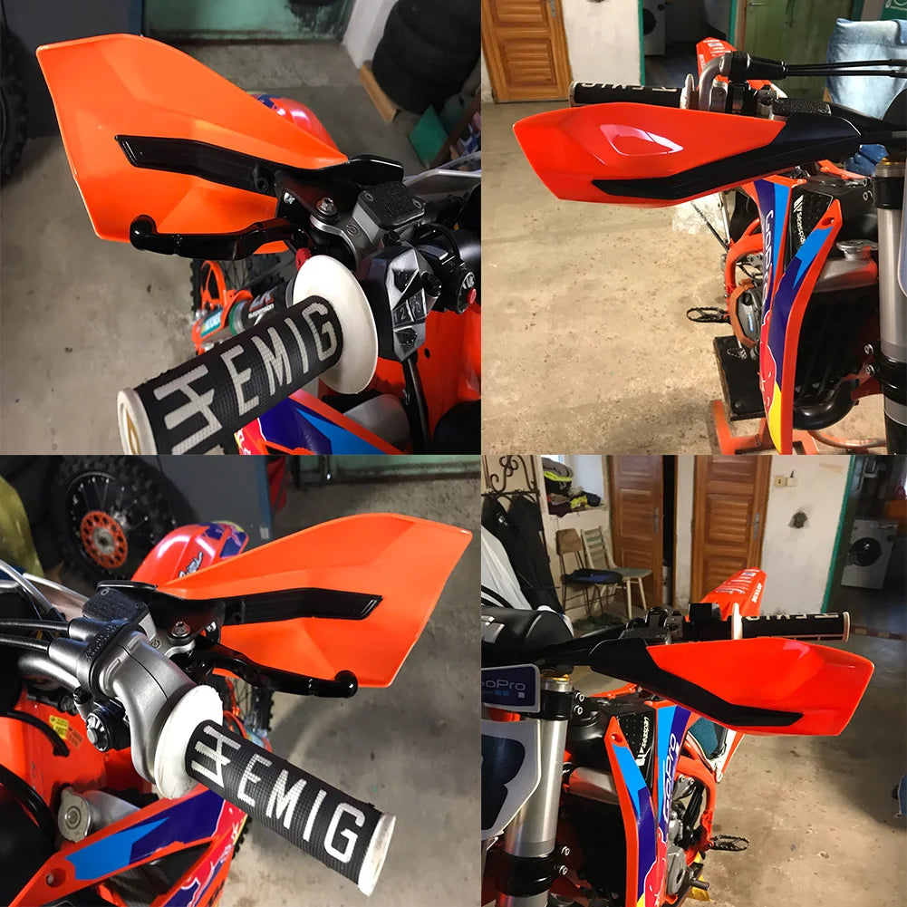 Close-up view of bright orange motorcycle handguards with black mounts and aluminum alloy components.