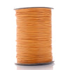 A spool of orange waxed cotton cord used for jewelry making