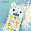 A light green musical teether phone toy featuring various buttons and a cute bear design, surrounded by small white pieces.