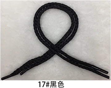A black gift string rope tied in an 'X' shape.