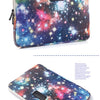 A purple and blue galaxy-themed laptop sleeve or pouch.