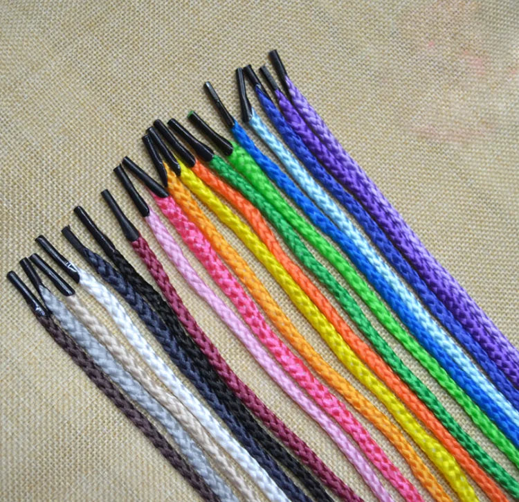 A bundle of multi-color polypropylene string rope in various shades including black, white, pink, orange, green, blue, and pu