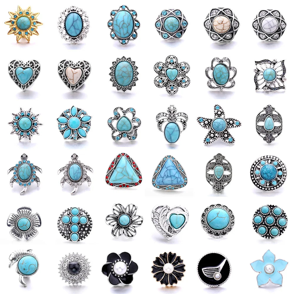 A collection of various decorative metal snap buttons and jewelry findings for crafting.