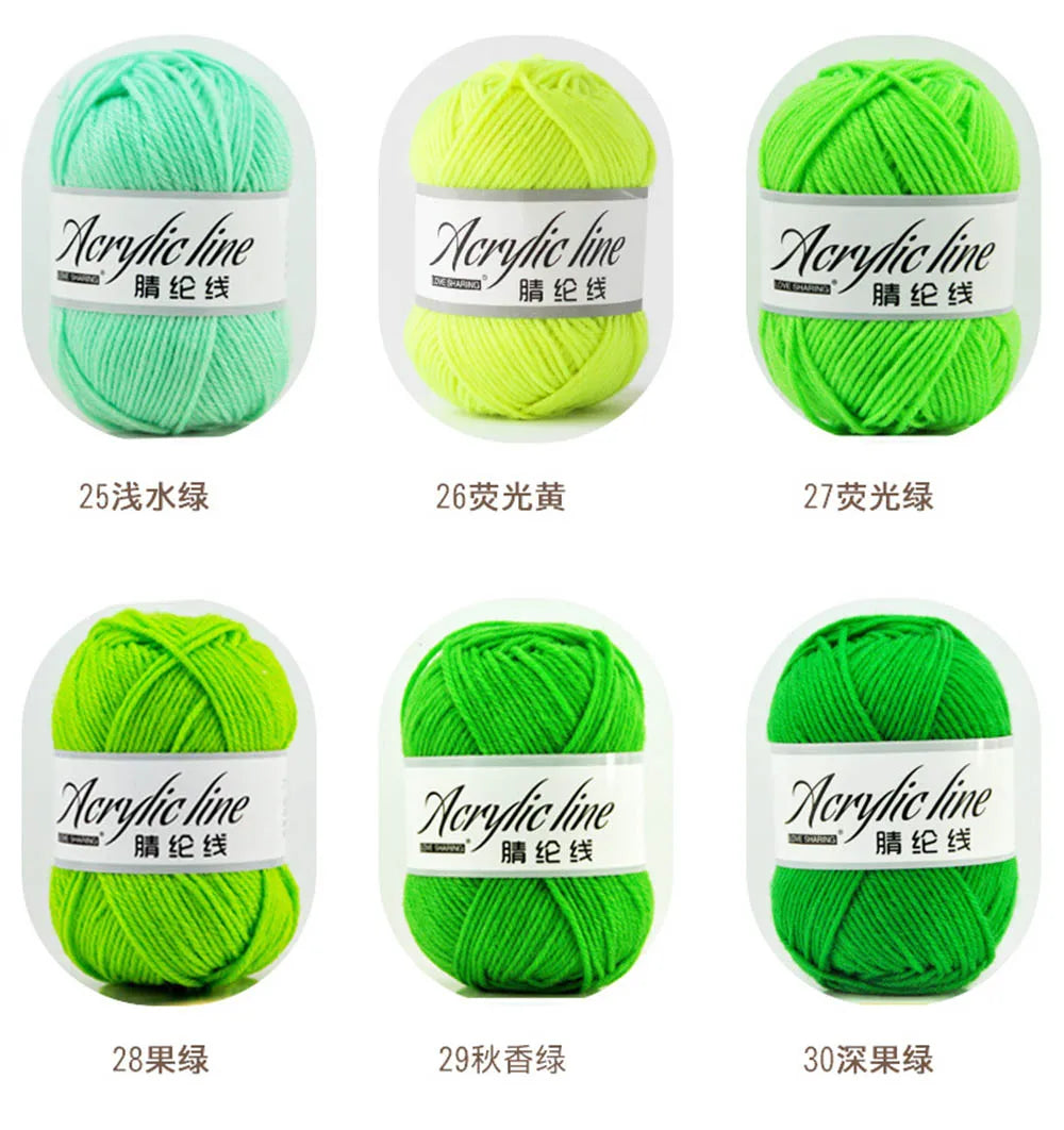 A set of acrylic line yarn balls in various shades including light green, yellow, lime green, bright green, and dark green.