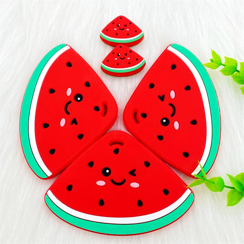 Red silicone watermelon fruit shapes used as teether pendants for babies