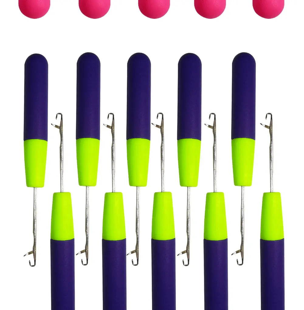 A row of purple and neon green hair weaving crochet hooks or needles.