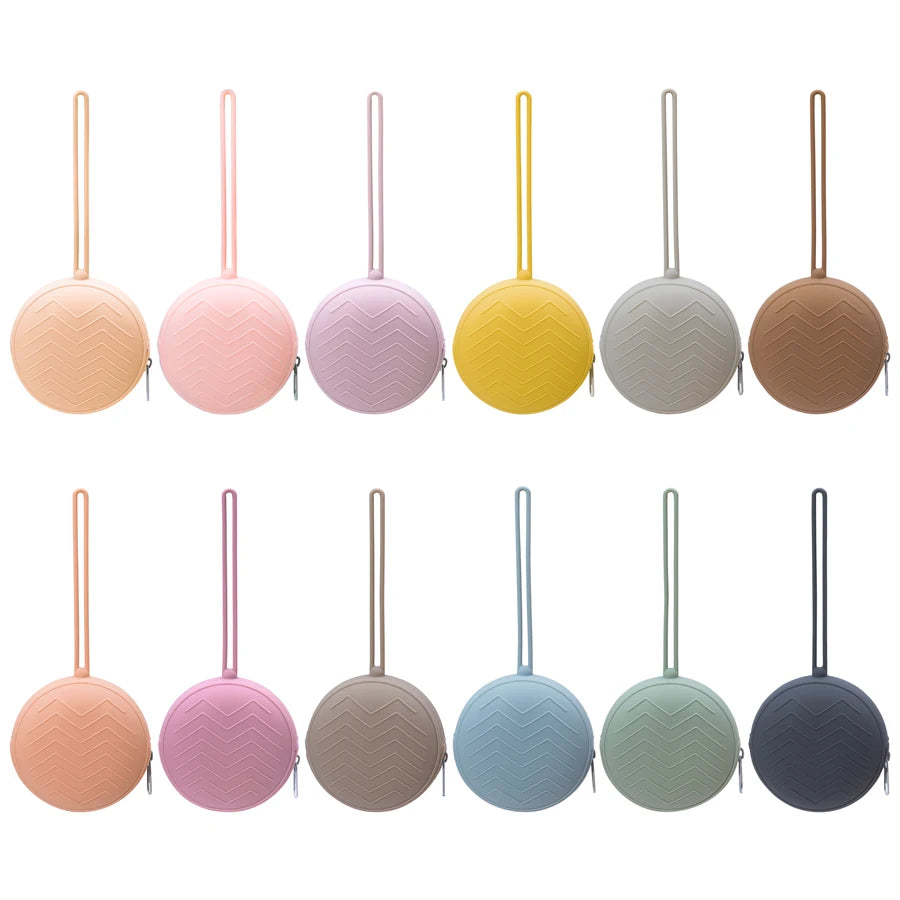 A set of nine food-grade silicone pacifier cases in various pastel and neutral colors.