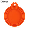 Orange reusable silicone food storage lid with a handle