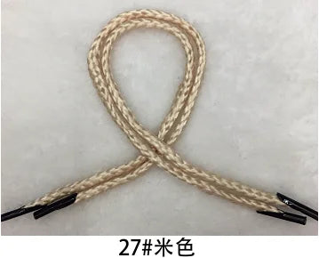 A bundle of beige multi-color polypropylene gift string rope tied in an 'X' shape.