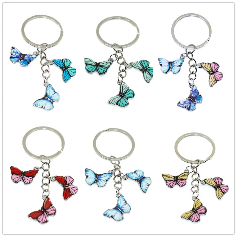 A set of colorful butterfly keychain charms with silver rings for bags and keys