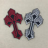 A pair of embroidered cross iron-on patches, one in black and red stripes and the other in black and white stripes.