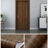 Close-up of dark brown wood grain self-adhesive wallpaper roll used for interior doors and furniture.