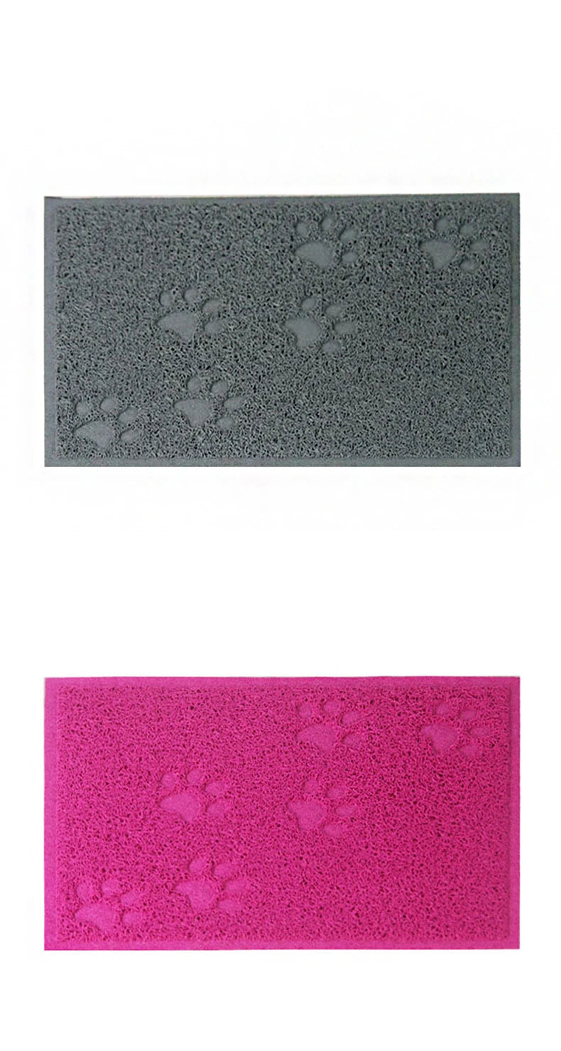 A pair of rectangular cat litter mats, one gray and one pink, both featuring paw print designs.