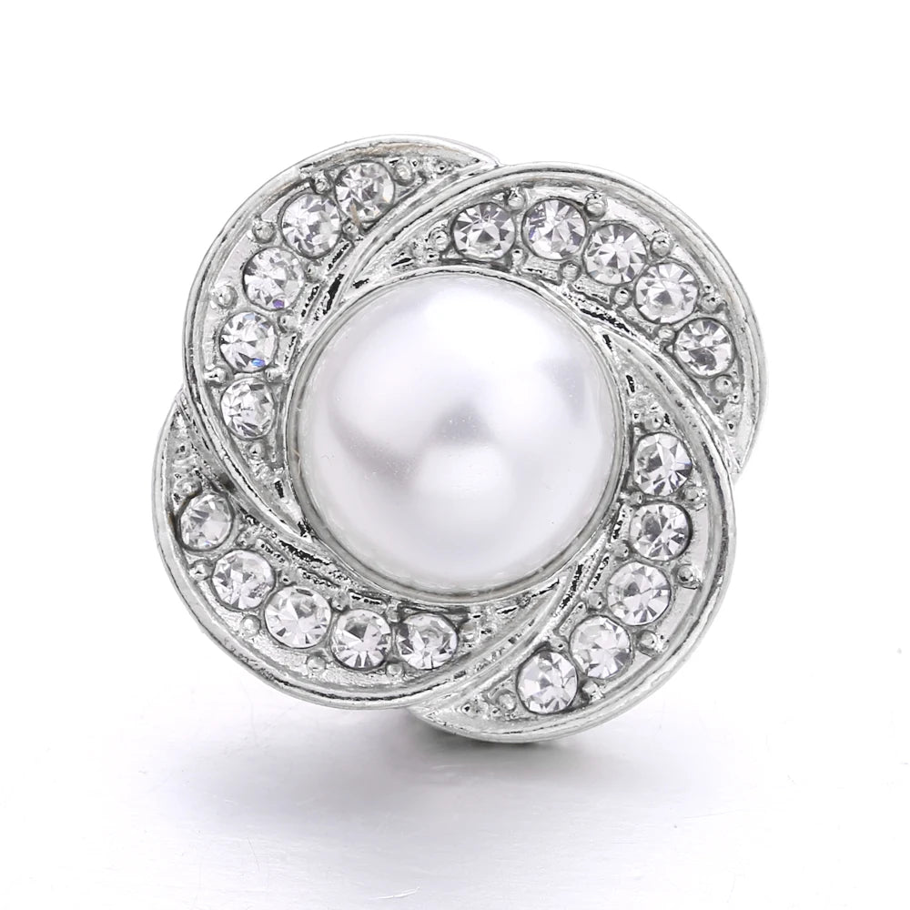 Silver snap buttons for jewelry making featuring a central pearl surrounded by clear rhinestones