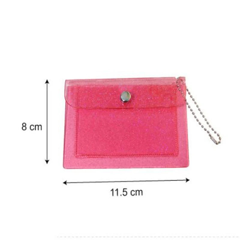 A pink glitter PVC card holder with a silver clasp and chain.