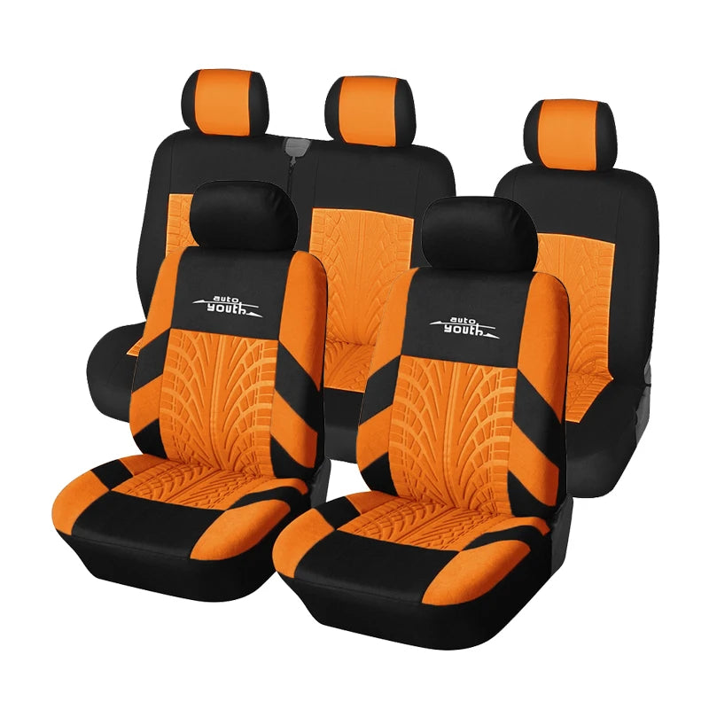 Two orange and black car seat covers for a vehicle, shown in a side view.