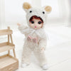 A fluffy white animal-eared fashion doll wearing a matching outfit and bow