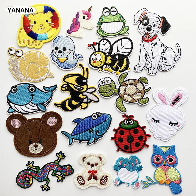 A collection of embroidered animal patches featuring various animals like cats, frogs, bees, and rabbits.