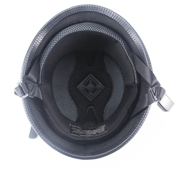 Matte black vintage German half-face motorcycle helmet with a textured interior and strap visible from above.