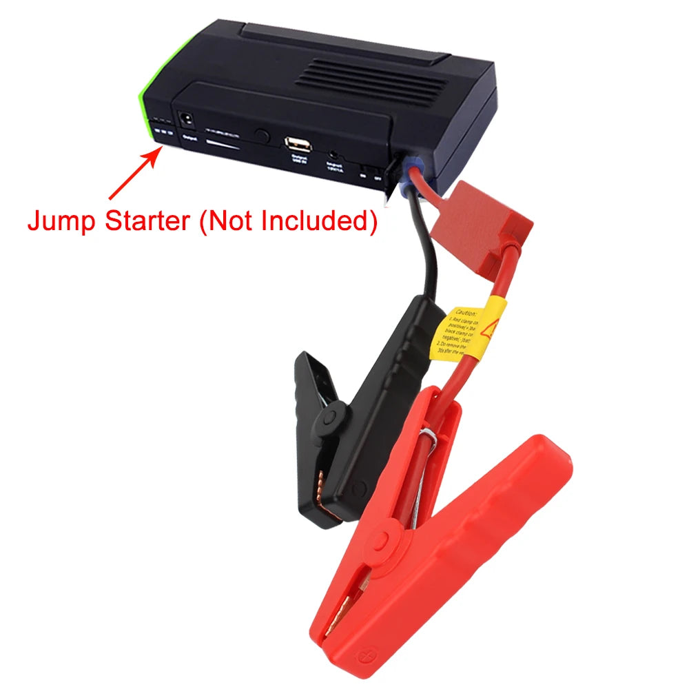 A black jump starter device is shown with red clamps and a yellow jump starter connector, indicating it is not included.