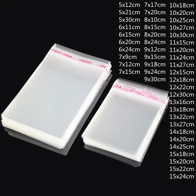 A collection of clear self-adhesive resealable storage bags in various sizes and dimensions displayed on a dark background.