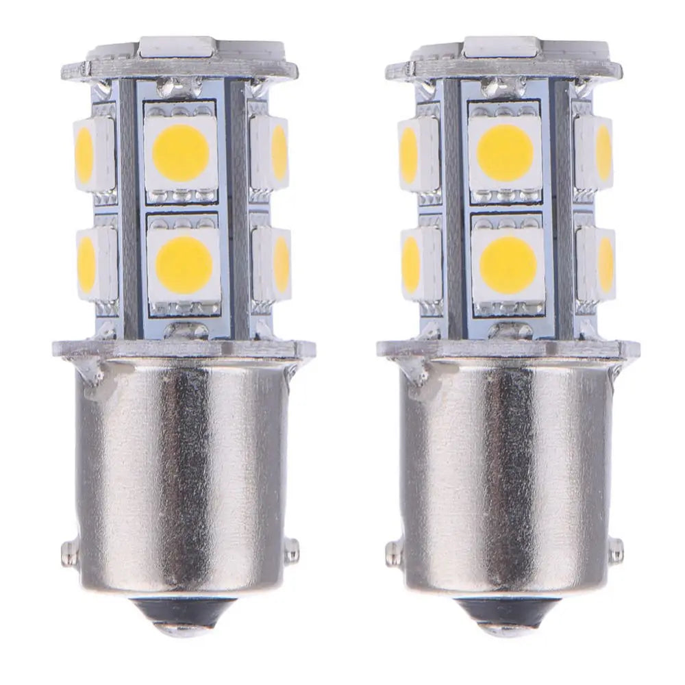 A pair of silver LED bulbs with yellow light, designed for turn signal and reverse lights.