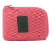 A pink mesh pouch for organizing travel cables and accessories.