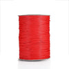 A spool of red waxed cotton cord for jewelry making