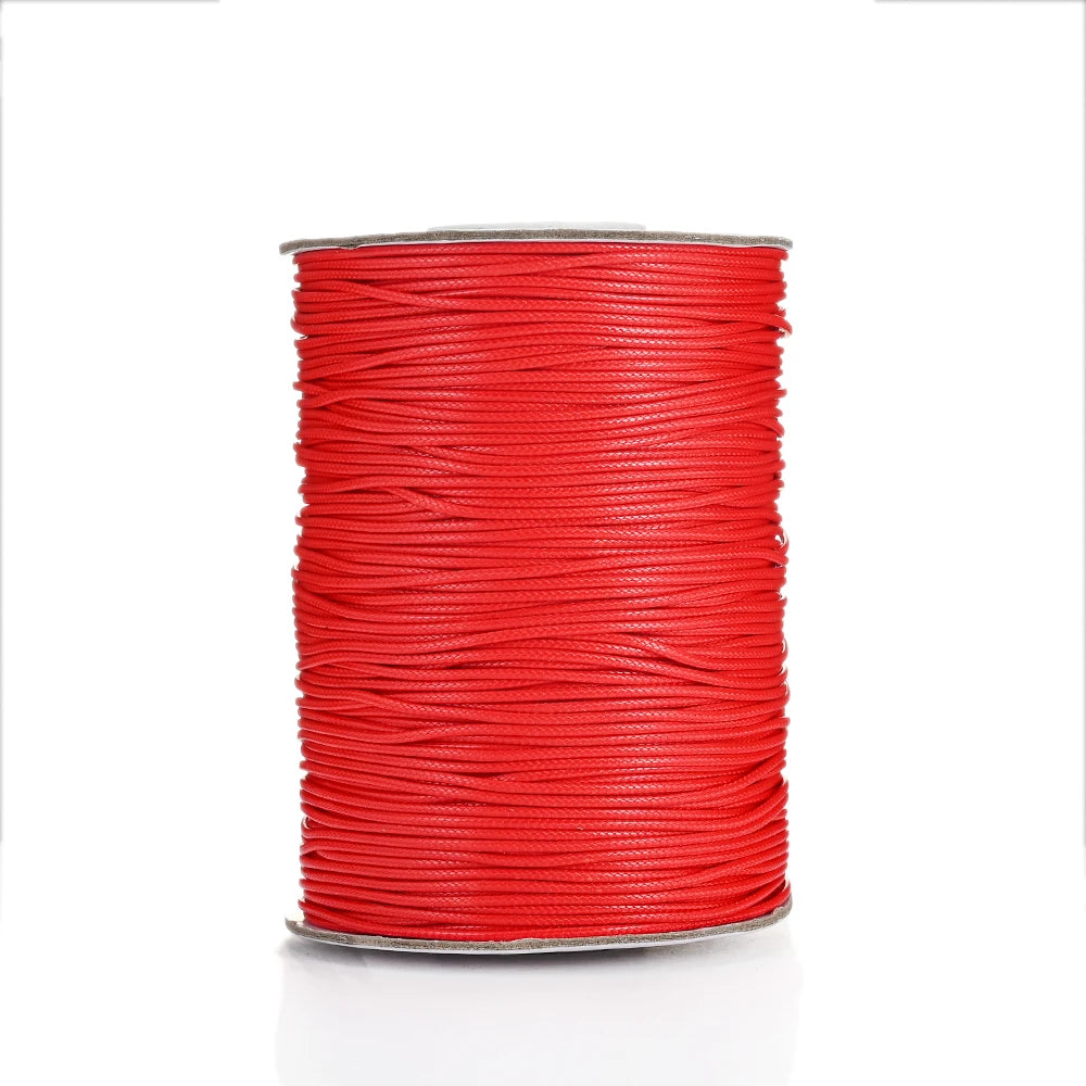 A spool of red waxed cotton cord for jewelry making