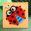 A wooden puzzle featuring a red and black ladybug design on a light wood background.