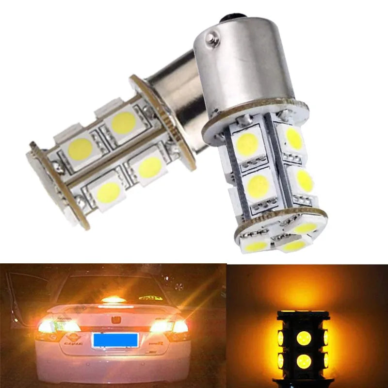 A close-up view of an SMD LED bulb designed for turn signal and reverse lights, shown next to a vehicle headlight.