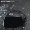A black modular flip-up motorcycle helmet is shown against a dark, textured background.