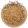 A clear glass seed bead product featuring small amber and gold colored beads arranged in a circular dish with a bow.
