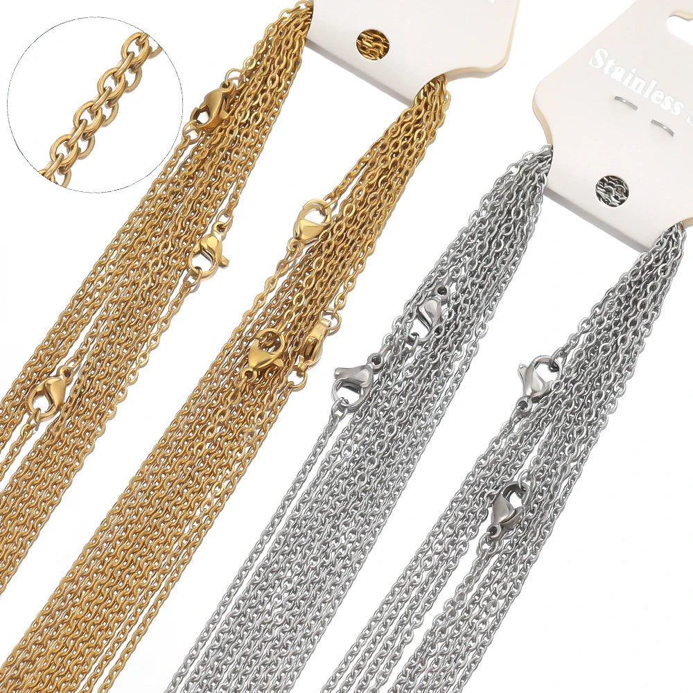 Three stainless steel link chain necklaces in gold and silver colors displayed against a white background.