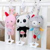 A soft plush baby rattle toy featuring cartoon animals hanging from a mobile structure.
