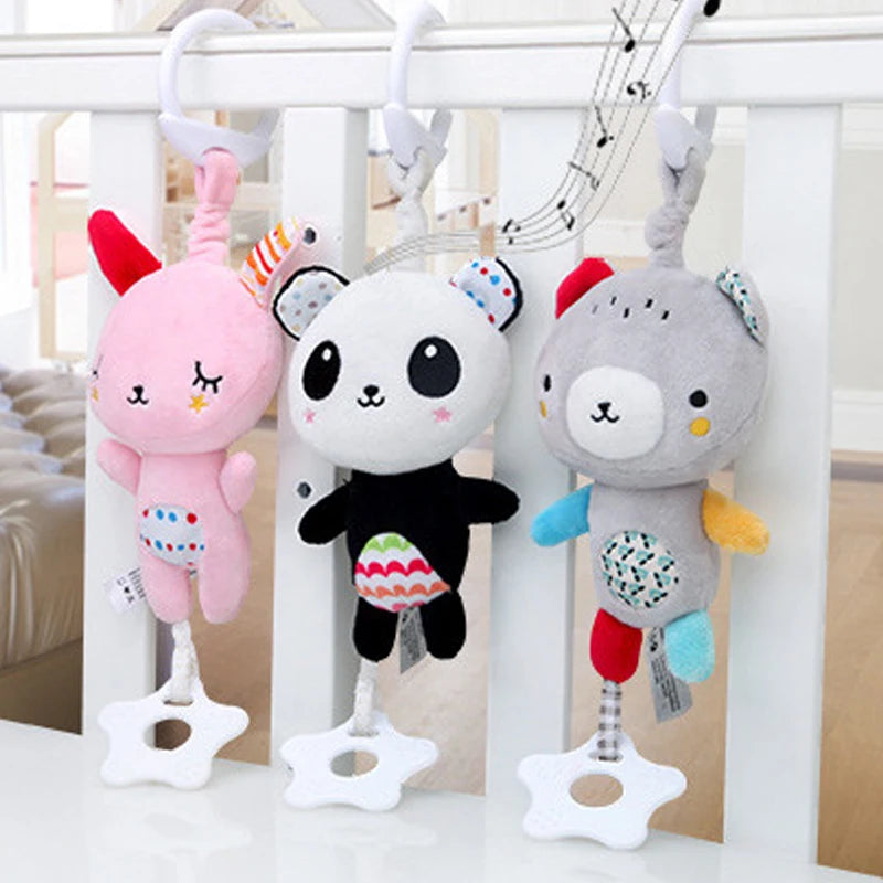 A soft plush baby rattle toy featuring cartoon animals hanging from a mobile structure.